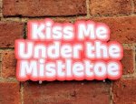 Kiss me under the Mistletoe photo booth sign