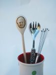 Sir David Attenborough  on a wooden spoon in a utensil pot