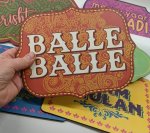 Hand holding Balle Balle sign to show size